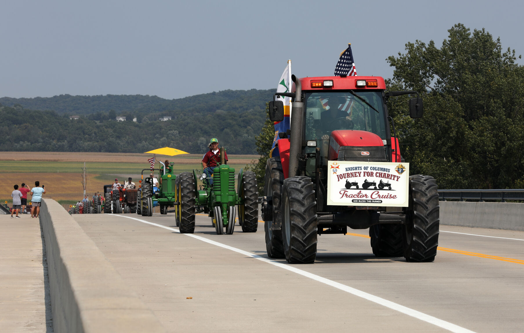 Tractors cross the Highway 47 bridge